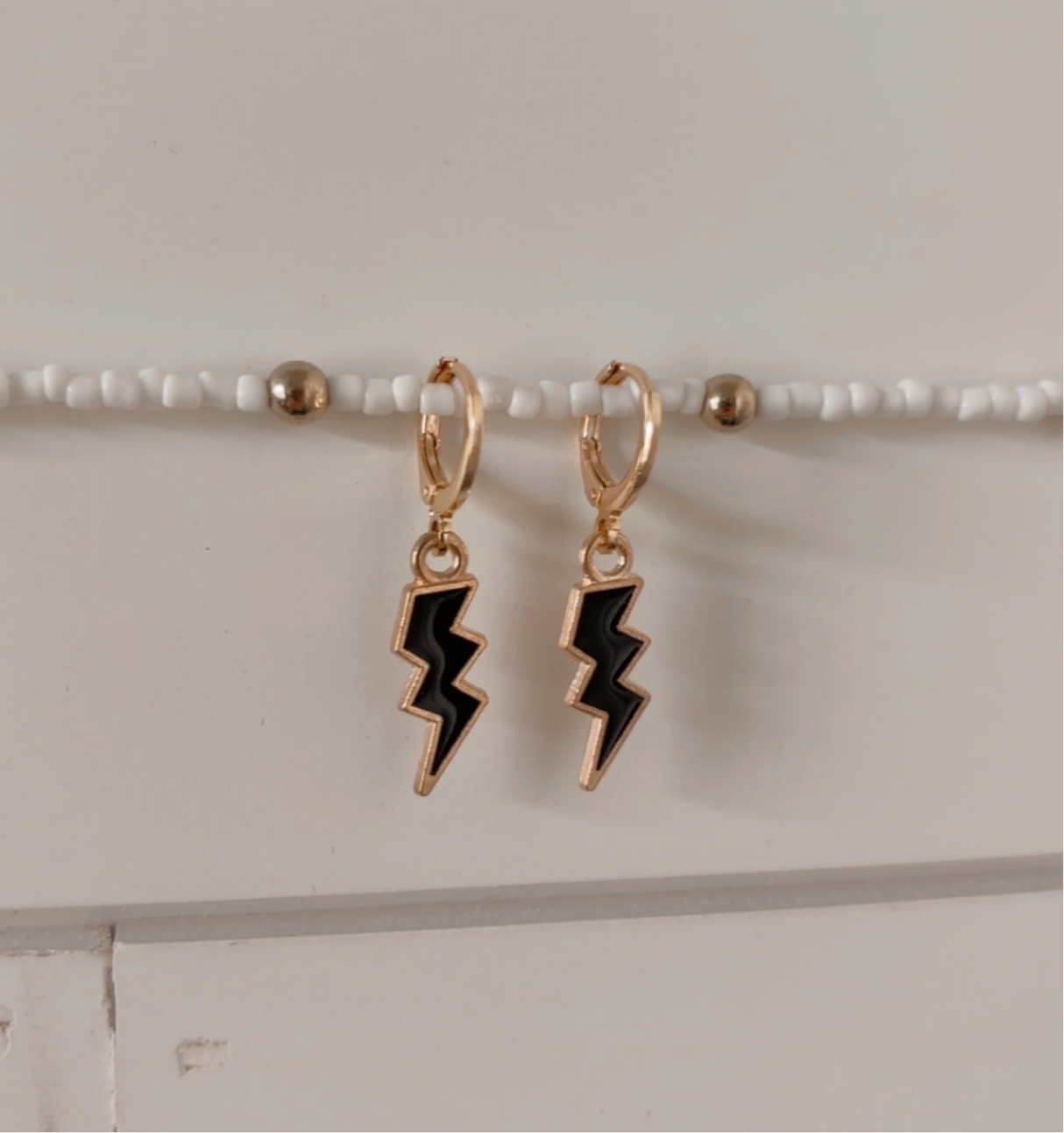 electric mood huggie earrings