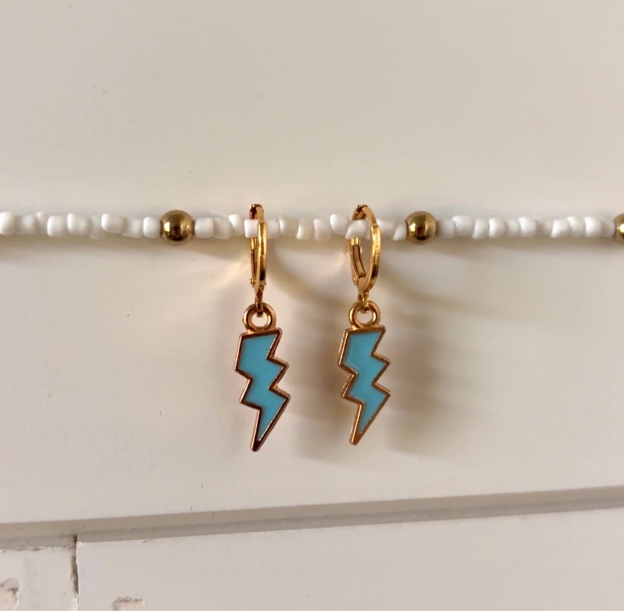 electric mood huggie earrings