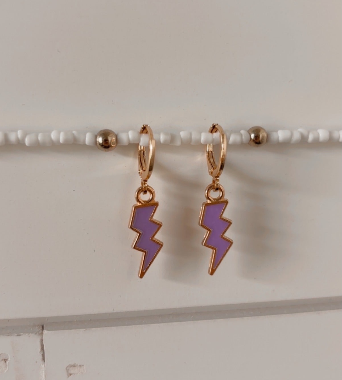 electric mood huggie earrings