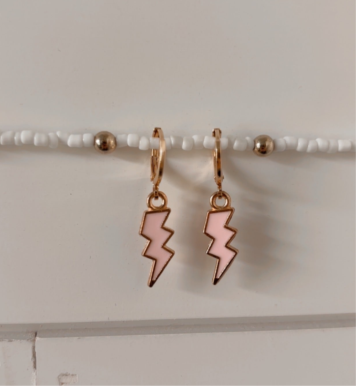 electric mood huggie earrings